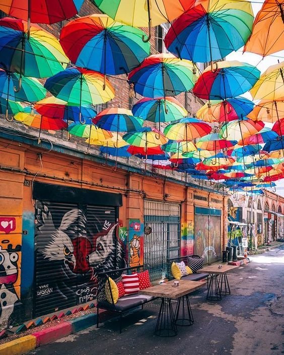 street and graffiti with colorful umbrellas